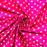 115CM PRINTED POLY COTTON WHITE STARS PINK BACKGROUND